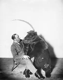 Lederhosen: Circus animal trainer with a bear, 1924