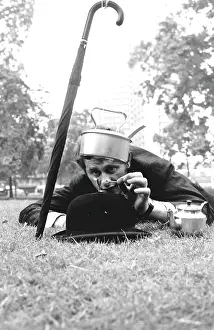 Hatted: City gent in a park