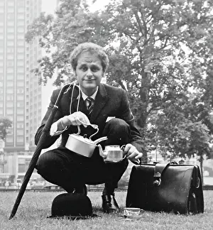 Hatted: City gent in a park