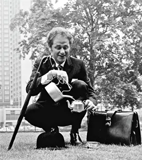 Hatted: City gent in a park
