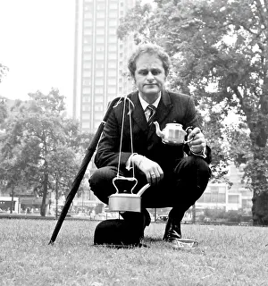 Hatted: City gent in a park