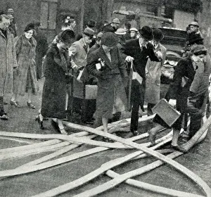 Hoses: City of London office workers after a night raid, WW2