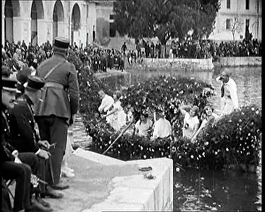 Margin: Civilians on the Margin of a River Throwing