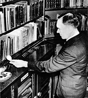 Librarian: C.J. Purnell Holding an Incendiary Bomb