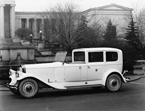 Affluent: Classic car parked outside building