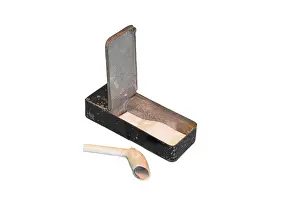 Boxed: Clay pipe and tin