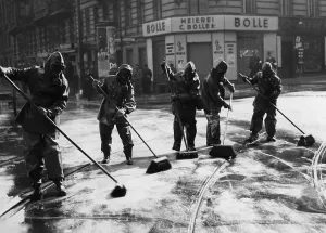 Broom: Cleaning up after an air raid drill, 1935