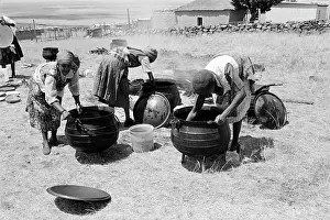 Reprieve: Cleaning the cooking pots after a feast to celebrate