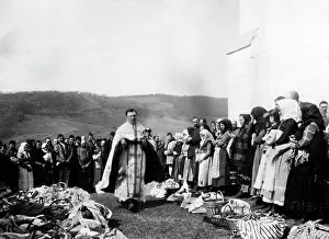 Cleric: A cleric consecrates offerings, 1915