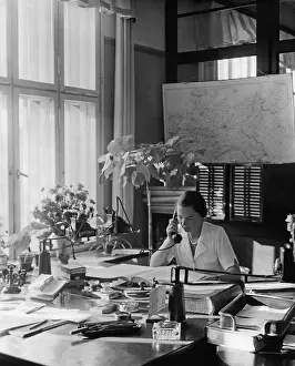 Furnished: Clerks working in an office space, 1937