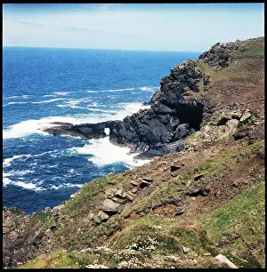 Carn: Cliffs at Carn Vellan and waves crashing around natural arch
