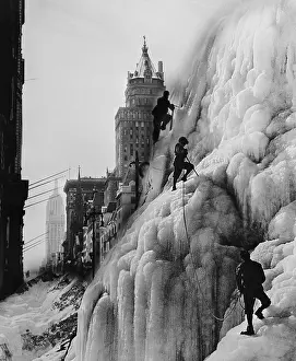 Risks: Climbers on glacier with skyscrapers in background