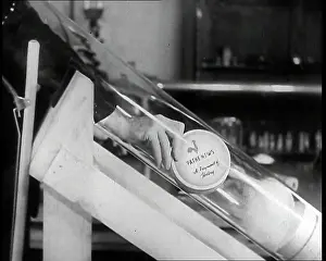 Labelled: Close Up of a British Man Inserting A Pathe