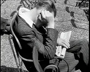 Propping: A Close Up of a Man Sitting in a Park with