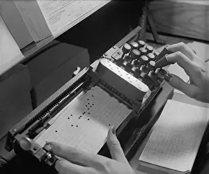 Computation: Close up of mechanism used to make precise holes