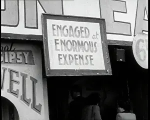 Expense: Close up on a Sign at a Seaside Show Reading
