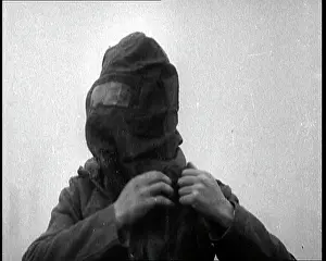 Showcasing: Close Up of a Soldier Putting On His Gas Mask