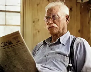 Newsprint: Close-Up of Elderly Man with Mustache wearing