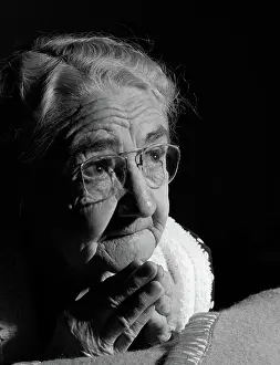 Crs001: Close-up of elderly woman praying at bedside