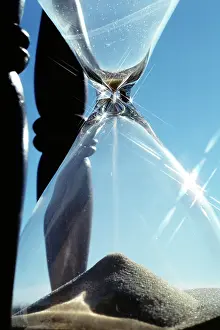 Abe001: Close-Up Sand Falling Through Hourglass