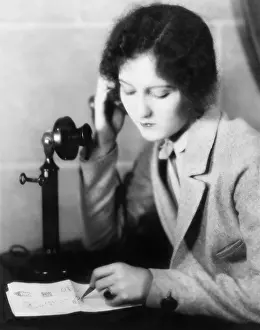 Drafting: Close-up of a woman talking on the telephone and