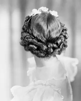 Hairdos: Closeup of curls on back of womans head