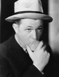 Fedora: Closeup of man eating apple