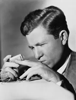 Focused: Closeup of man repairing lighter