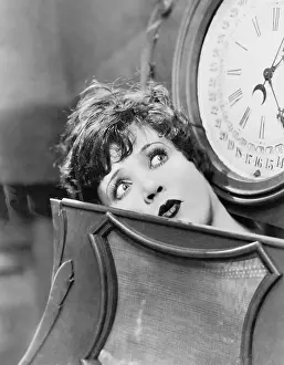 Surprises: Closeup of woman inside clock