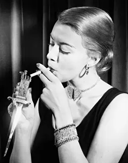 Addicts: Closeup of woman lighting cigarette