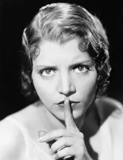 Intensity: Closeup of woman shushing