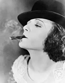 Bowlers: Closeup of woman smoking cigar