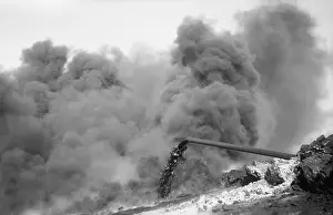 Obscure: Clouds of black smoke obscure fire on an ?