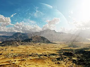 Topography: Clouds break over a desert on Matsya, giving a glimpse of ?