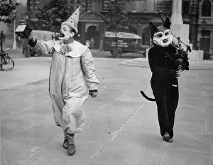 Bagpipe: A clown and a dressed bagpipe player