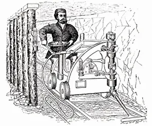 Rails: Coal cutting machine on rails, powered by compressed
