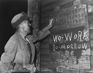 Loader: A coal loader putting up his check at the end