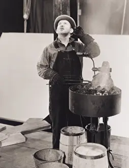 Tongs: Coal worker distracted from his work
