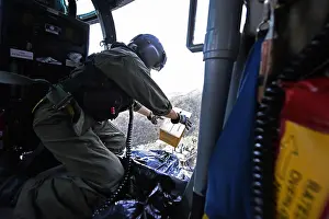 Hurricanes: US Coast Guard helicopter drops a box of MREs to