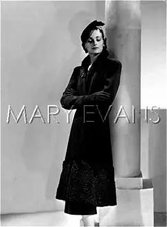 Marcelle: COAT WITH ASTRAKHAN TRIM