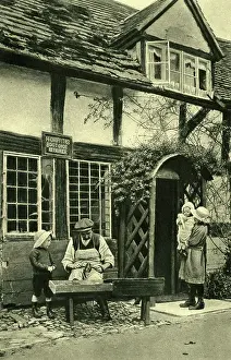 Timbered: Cobbler at work outside his cottage, Wigmore, Herefordshire