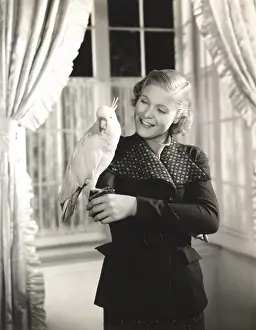 Cockatoo: Cockatoo perched on woman's hand