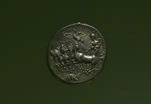 Quadriga: Coin with depiction of a quadriga driven by a charioteer