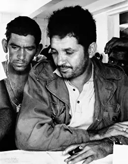 Oriente: Col. Vincente Mendez views a map of his ?