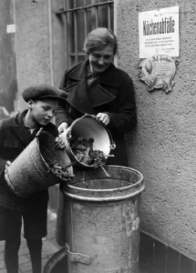 Four Year: Collecting kitchen waste for a piggery of the NSV in Ber