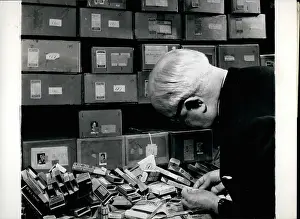Collaborators: Colonel Bagnall, cigarette card collector, at work