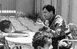 Shirts: Colonel Gaddafi with his two sons at home, Tripoli