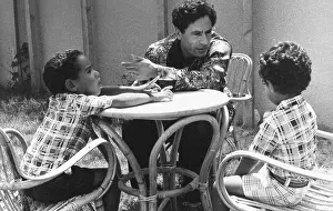 Shirts: Colonel Gaddafi with his two sons at home, Tripoli