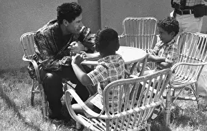 Shirts: Colonel Gaddafi with his two sons at home, Tripoli