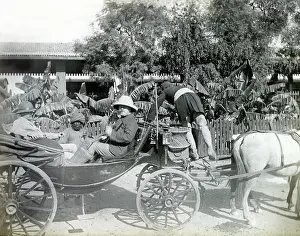 Pith: Colonial British men in carriage, India